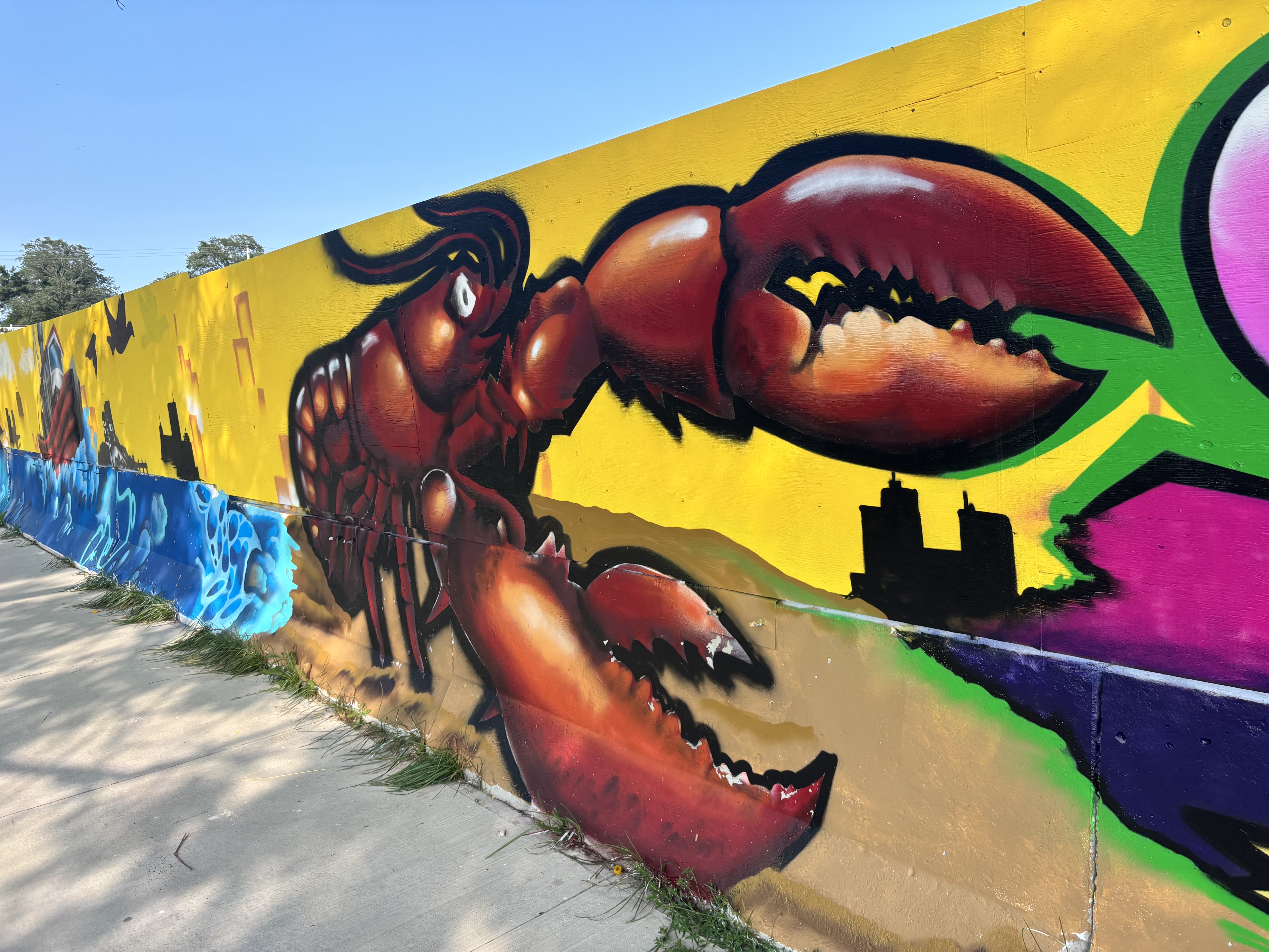 Bright outdoor mural of a lobster