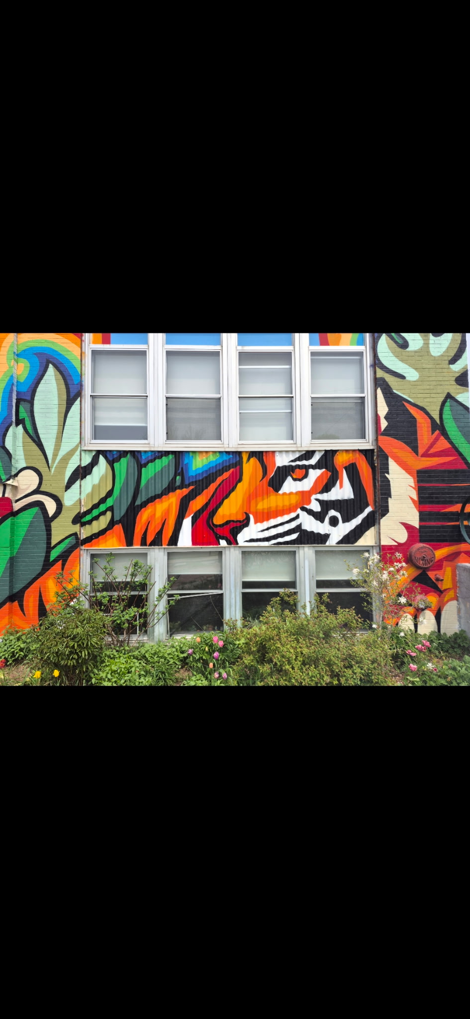 Close detail of the St. Catherine's Elementary exterior mural
